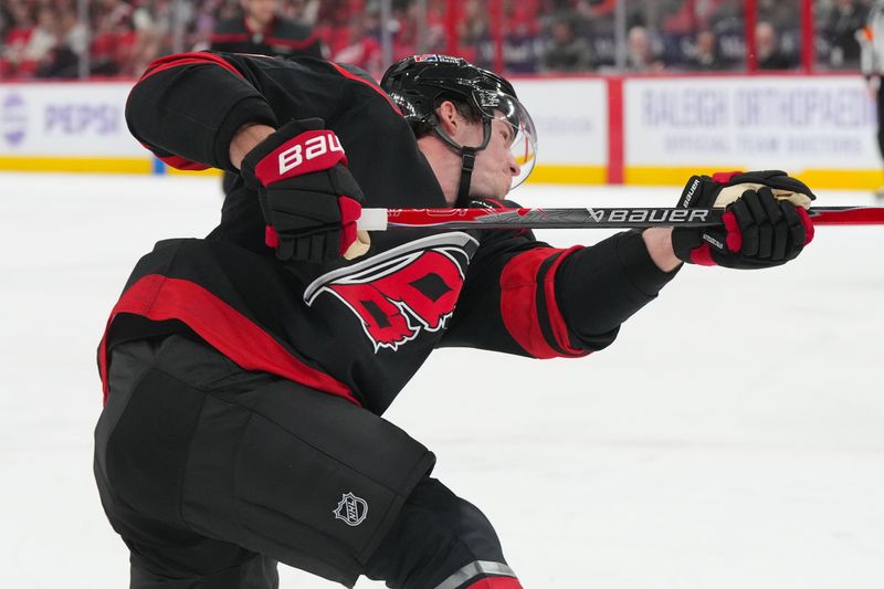 Nov 14, 2025; Raleigh, North Carolina, USA;  Carolina Hurricanes right wing Andrei Svechnikov (37) scores a goal on his shot against the Vancouver Canucks during the first period at Lenovo Center. Mandatory Credit: James Guillory-Imagn Images