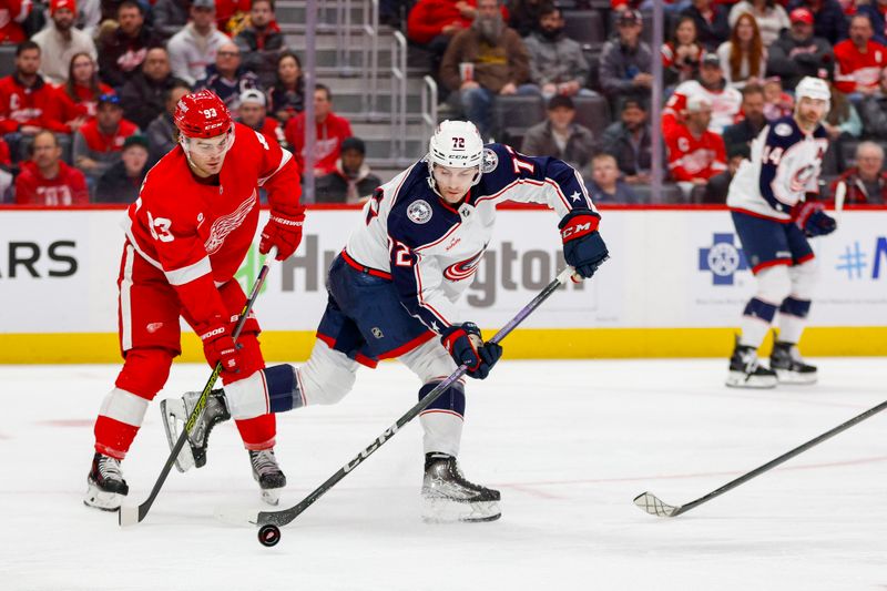 Mar 19, 2024; Detroit, Michigan, USA; Columbus Blue Jackets right wing Carson Meyer (72) handles the puck during the first period of the game against the Detroit Red Wings at Little Caesars Arena. Mandatory Credit: Brian Bradshaw Sevald-USA TODAY Sports