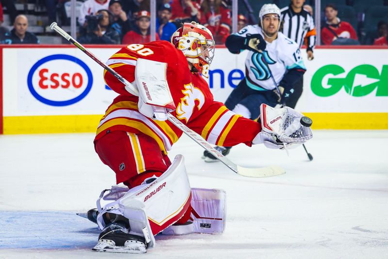 Nov 1, 2022; Calgary, Alberta, CAN; Calgary Flames goaltender Dan Vladar (80) makes a save against the Seattle Kraken during the first period at Scotiabank Saddledome. Mandatory Credit: Sergei Belski-USA TODAY Sports