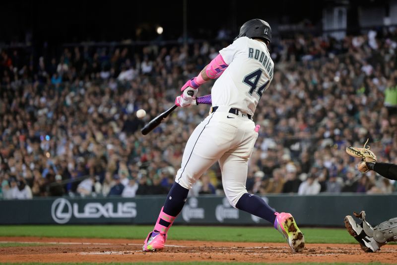 May 14, 2025; Seattle, Washington, USA; Seattle Mariners center fielder Julio Rodriguez (44) hits a two-RBI double against the New York Yankees during the third inning at T-Mobile Park. Mandatory Credit: John Froschauer-Imagn Images