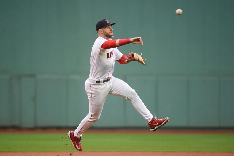 Sep 23, 2023; Boston, Massachusetts, USA; Boston Red Sox shortstop Trevor Story (10) throws the ball to first for an out during the first inning against the Chicago White Sox at Fenway Park. Mandatory Credit: Bob DeChiara-USA TODAY Sports