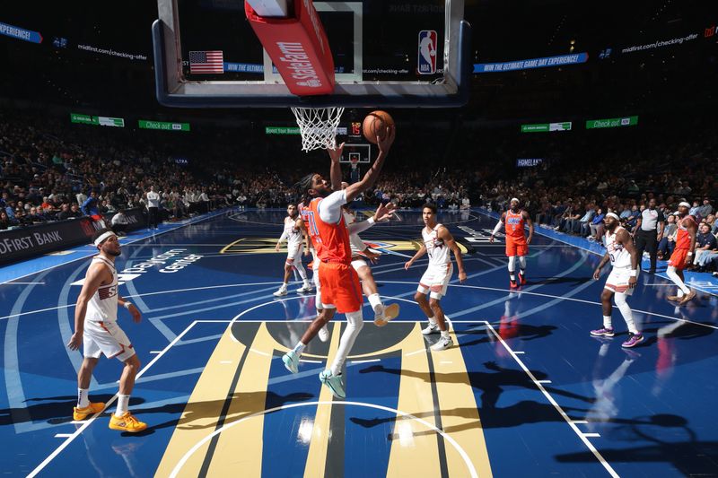 OKLAHOMA CITY, OK - NOVEMBER 15: Isaiah Joe #11 of the Oklahoma City Thunder drives to the basket during the game against the Phoenix Suns during the Emirates NBA Cup game on November 15, 2024 at Paycom Center in Oklahoma City, Oklahoma. NOTE TO USER: User expressly acknowledges and agrees that, by downloading and or using this photograph, User is consenting to the terms and conditions of the Getty Images License Agreement. Mandatory Copyright Notice: Copyright 2024 NBAE (Photo by Zach Beeker/NBAE via Getty Images)