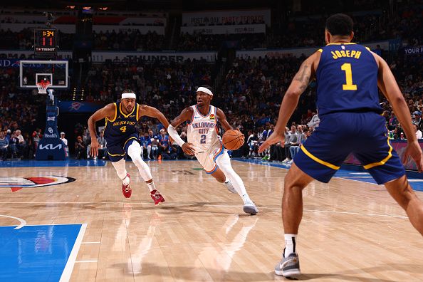 OKLAHOMA CITY, OK - DECEMBER 8: Shai Gilgeous-Alexander #2 of the Oklahoma City Thunder dribbles the ball during the game against the Golden State Warriors on December 8, 2023 at Paycom Arena in Oklahoma City, Oklahoma. NOTE TO USER: User expressly acknowledges and agrees that, by downloading and or using this photograph, User is consenting to the terms and conditions of the Getty Images License Agreement. Mandatory Copyright Notice: Copyright 2023 NBAE (Photo by Zach Beeker/NBAE via Getty Images)