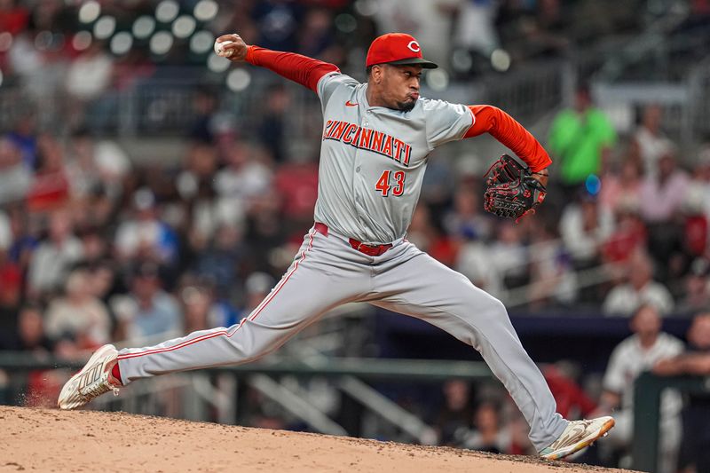 Sep 9, 2024; Cumberland, Georgia, USA; Cincinnati Reds relief pitcher Alexis Diaz (43) pitches against the Atlanta Braves during the ninth inning at Truist Park. Mandatory Credit: Dale Zanine-Imagn Images