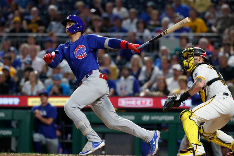 Aug 26, 2024; Pittsburgh, Pennsylvania, USA;  Chicago Cubs catcher Miguel Amaya (9) hits a two run double  against the Pittsburgh Pirates during the sixth inning at PNC Park. Mandatory Credit: Charles LeClaire-USA TODAY Sports