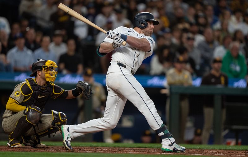 Sep 11, 2024; Seattle, Washington, USA;  Seattle Mariners first baseman Luke Raley (20) hits a two-run single during the third inning against the San Diego Padres at T-Mobile Park. Mandatory Credit: Stephen Brashear-Imagn Images