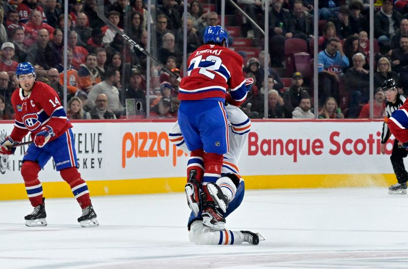 Nov 18, 2024; Montreal, Quebec, CAN; Montreal Canadiens defenseman Arber Xhekaj (72) hits Edmonton Oilers forward Zach Hyman (18) during the first period at the Bell Centre. Mandatory Credit: Eric Bolte-Imagn Images