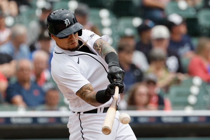 Jun 11, 2023; Detroit, Michigan, USA; Detroit Tigers shortstop Javier Baez (28) hits a sacrifice fly to score a run in the third inning against the Arizona Diamondbacks at Comerica Park. Mandatory Credit: Rick Osentoski-USA TODAY Sports