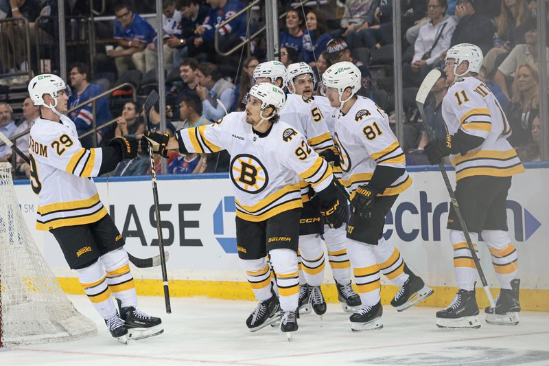 Sep 23, 2025; New York, New York, USA; Boston Bruins center Marat Khusnutdinov (92) celebrates with teammates during the third period of a preseason game against the New York Rangers at Madison Square Garden. Mandatory Credit: Vincent Carchietta-Imagn Images