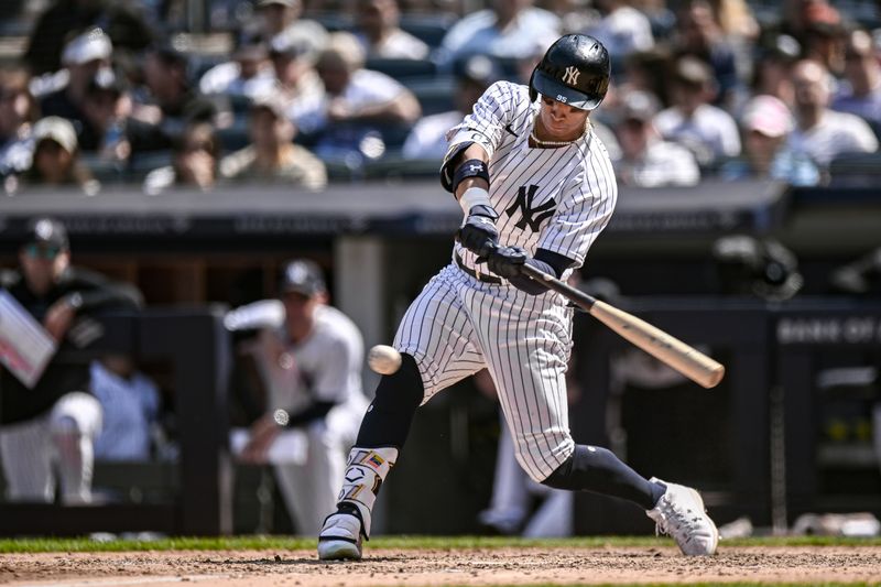 May 27, 2023; Bronx, New York, USA; New York Yankees left fielder Oswaldo Cabrera (95) hits a single against the San Diego Padres during the eighth inning at Yankee Stadium. Mandatory Credit: John Jones-USA TODAY Sports