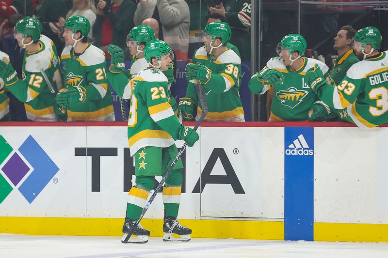 Dec 3, 2023; Saint Paul, Minnesota, USA; Minnesota Wild center Marco Rossi (23) is congratulated for his goal against the Chicago Blackhawks during the first period at Xcel Energy Center. Mandatory Credit: Matt Krohn-USA TODAY Sports