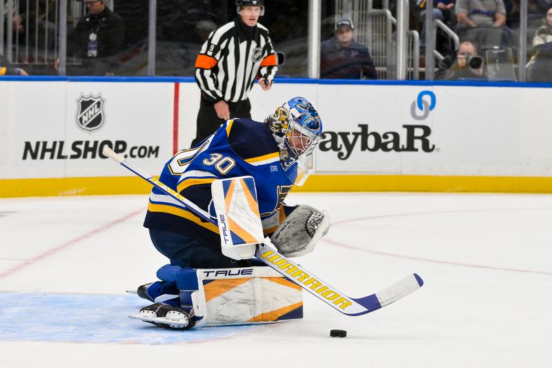 Oct 17, 2024; St. Louis, Missouri, USA;  St. Louis Blues goaltender Joel Hofer (30) defends the net against the New York Islanders during the first period at Enterprise Center. Mandatory Credit: Jeff Curry-Imagn Images