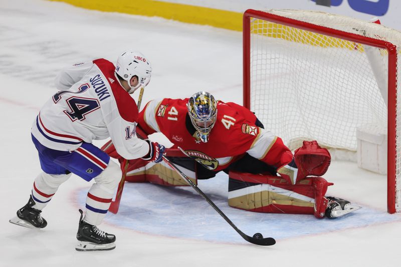 Feb 29, 2024; Sunrise, Florida, USA; Florida Panthers goaltender Anthony Stolarz (41) stops a penalty shot against Montreal Canadiens center Nick Suzuki (14) during a shoutout at Amerant Bank Arena. Mandatory Credit: Sam Navarro-USA TODAY Sports