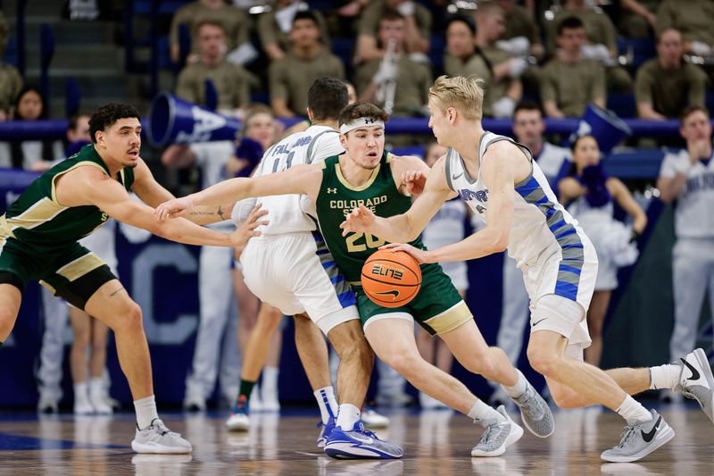 Mar 9, 2024; Colorado Springs, Colorado, USA; Air Force Falcons forward Rytis Petraitis (31) controls the ball as Colorado State Rams guard Joe Palmer (20) and forward Joel Scott (1) guard in the first half at Clune Arena. Mandatory Credit: Isaiah J. Downing-USA TODAY Sports