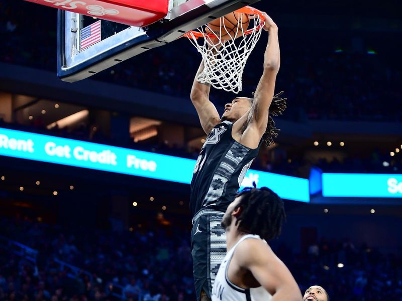 AUSTIN, TX - MARCH 17: Devin Vassell #24 of the San Antonio Spurs dunks the ball during overtime of the game against the Brooklyn Nets on March 17, 2024 at the Moody Center in Austin, Texas. NOTE TO USER: User expressly acknowledges and agrees that, by downloading and or using this photograph, user is consenting to the terms and conditions of the Getty Images License Agreement. Mandatory Copyright Notice: Copyright 2024 NBAE (Photos by Michael Gonzales/NBAE via Getty Images)