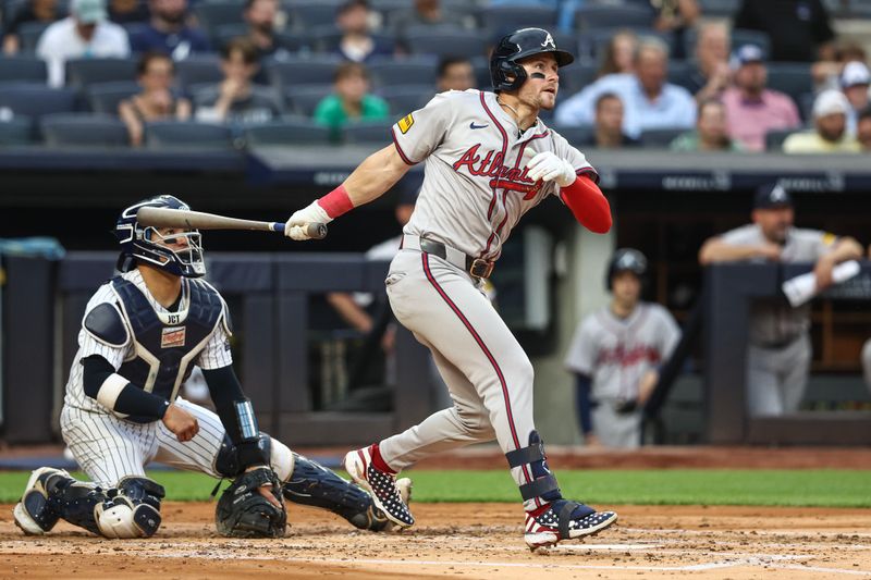 Jun 21, 2024; Bronx, New York, USA; Atlanta Braves center fielder Jarred Kelenic (24) hits an RBI single in the second inning against the New York Yankees at Yankee Stadium. Mandatory Credit: Wendell Cruz-USA TODAY Sports