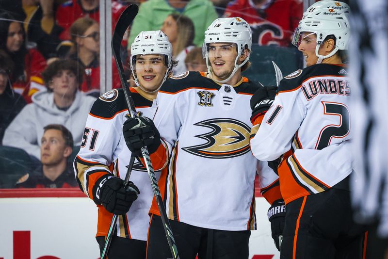 Apr 2, 2024; Calgary, Alberta, CAN; Anaheim Ducks right wing Troy Terry (19) celebrates his goal with teammates against the Calgary Flames during the second period at Scotiabank Saddledome. Mandatory Credit: Sergei Belski-USA TODAY Sports