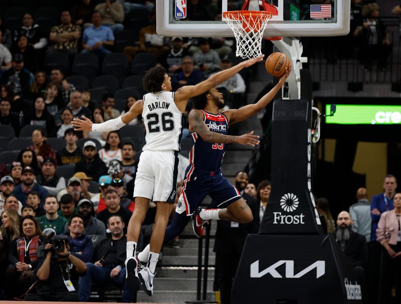 SAN ANTONIO, TX - JANUARY  29:  Marvin Bagley III #35 of the Washington Wizards puts up a shot against Dominick Barlow #26 of the San Antonio Spurs in the first half at Frost Bank Center on January 29, 2024 in San Antonio, Texas. NOTE TO USER: User expressly acknowledges and agrees that, by downloading and or using this photograph, User is consenting to terms and conditions of the Getty Images License Agreement. (Photo by Ronald Cortes/Getty Images)