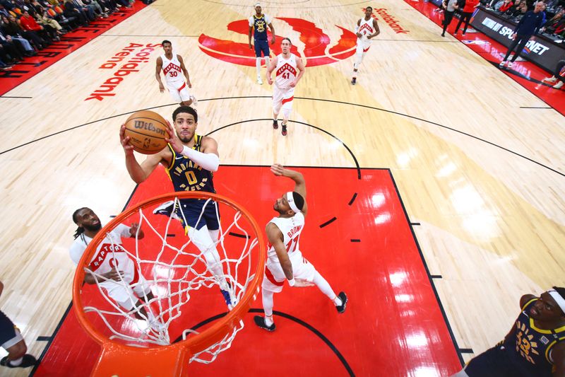 TORONTO, CANADA - APRIL 9:  Tyrese Haliburton #0 of the Indiana Pacers goes to the basket during the game on April 9, 2024 at the Scotiabank Arena in Toronto, Ontario, Canada.  NOTE TO USER: User expressly acknowledges and agrees that, by downloading and or using this Photograph, user is consenting to the terms and conditions of the Getty Images License Agreement.  Mandatory Copyright Notice: Copyright 2024 NBAE (Photo by Vaughn Ridley/NBAE via Getty Images)