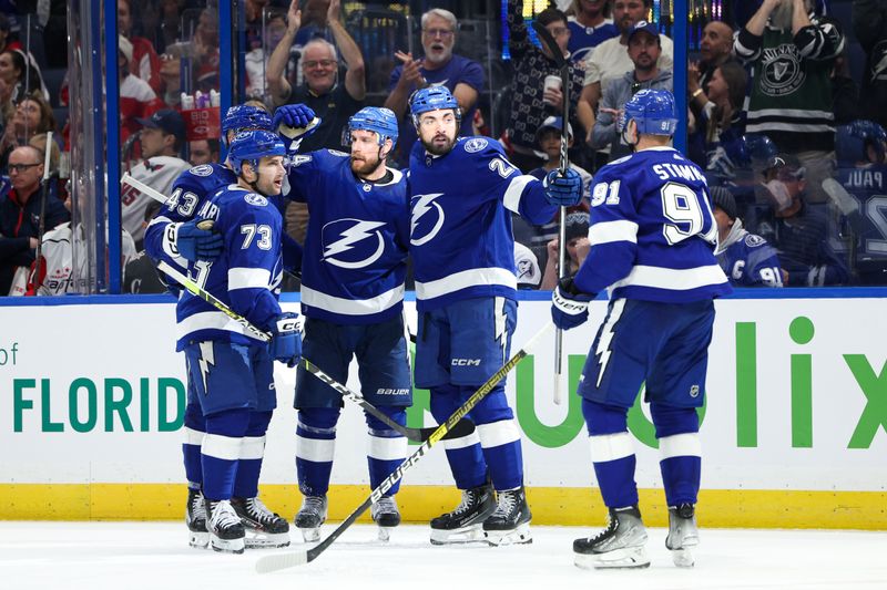 Feb 22, 2024; Tampa, Florida, USA;  Tampa Bay Lightning left wing Nicholas Paul (20) celebrates with center Steven Stamkos (91) after scoring a goal against the Washington Capitals in the third period at Amalie Arena. Mandatory Credit: Nathan Ray Seebeck-USA TODAY Sports