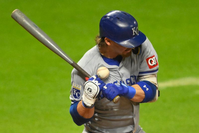 Aug 27, 2024; Cleveland, Ohio, USA; Kansas City Royals shortstop Bobby Witt Jr. (7) is hit by a pitch in the seventh inning against the Cleveland Guardians at Progressive Field. Mandatory Credit: David Richard-USA TODAY Sports