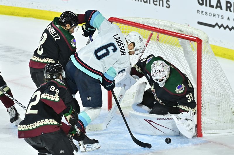 Nov 7, 2023; Tempe, Arizona, USA; Arizona Coyotes goaltender Connor Ingram (39) makes a save on Seattle Kraken defenseman Adam Larsson (6) in the overtime at Mullett Arena. Mandatory Credit: Matt Kartozian-USA TODAY Sports