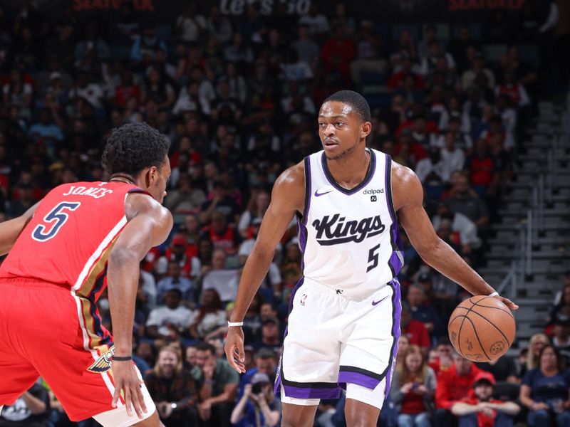 NEW ORLEANS, LA - APRIL 19:  De'Aaron Fox #5 of the Sacramento Kings handles the ball during the game against the New Orleans Pelicans during the 2024 Play-In Tournament on April 19, 2024 at the Smoothie King Center in New Orleans, Louisiana. NOTE TO USER: User expressly acknowledges and agrees that, by downloading and or using this Photograph, user is consenting to the terms and conditions of the Getty Images License Agreement. Mandatory Copyright Notice: Copyright 2024 NBAE (Photo by Jeff Haynes./NBAE via Getty Images)