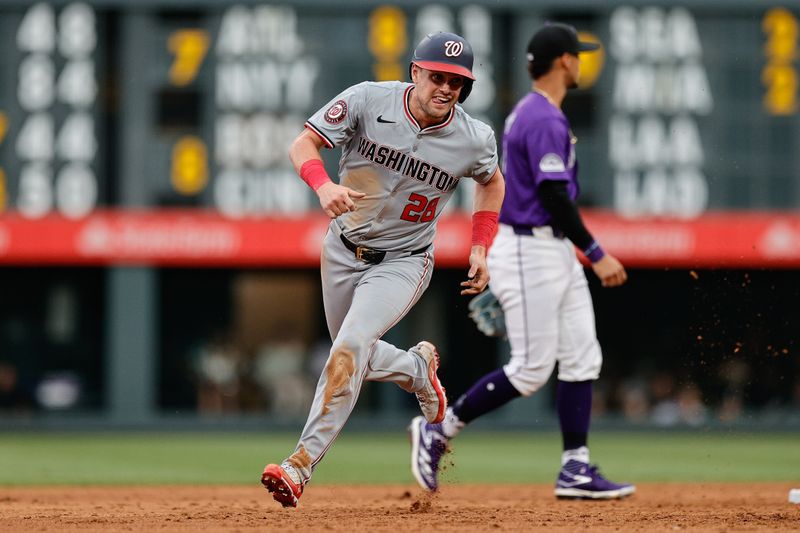 Jun 21, 2024; Denver, Colorado, USA; Washington Nationals right fielder Lane Thomas (28) rounds second on an RBI in the third inning against the Colorado Rockies at Coors Field. Mandatory Credit: Isaiah J. Downing-USA TODAY Sports