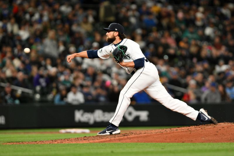 Apr 15, 2023; Seattle, Washington, USA; Seattle Mariners relief pitcher Penn Murfee (56) pitches to the Colorado Rockies during the seventh inning at T-Mobile Park. Mandatory Credit: Steven Bisig-USA TODAY Sports