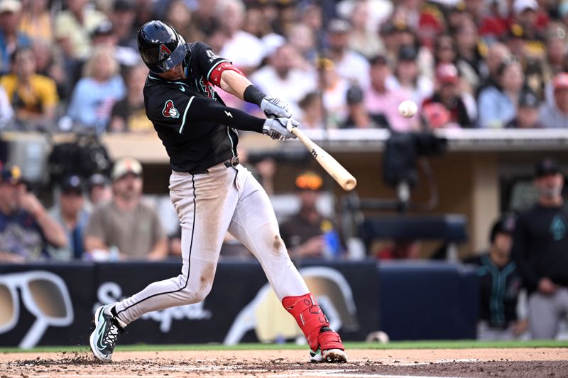 Jul 6, 2024; San Diego, California, USA; Arizona Diamondbacks second baseman Kevin Newman (18) hits an RBI single against the San Diego Padres during the second inning at Petco Park. Mandatory Credit: Orlando Ramirez-USA TODAY Sports