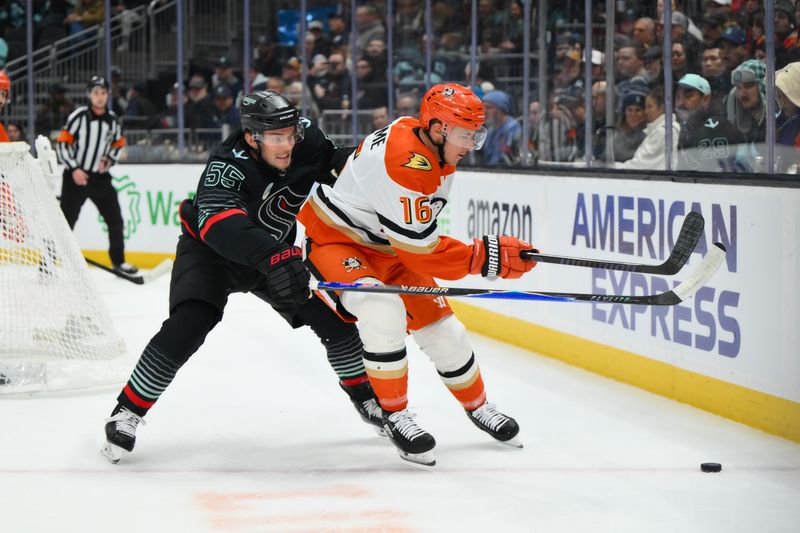 Jan 23, 2026; Seattle, Washington, USA; Seattle Kraken defenseman Ryan Lindgren (55) and Anaheim Ducks center Ryan Strome (16) play the loose puck during the first period at Climate Pledge Arena. Mandatory Credit: Steven Bisig-Imagn Images