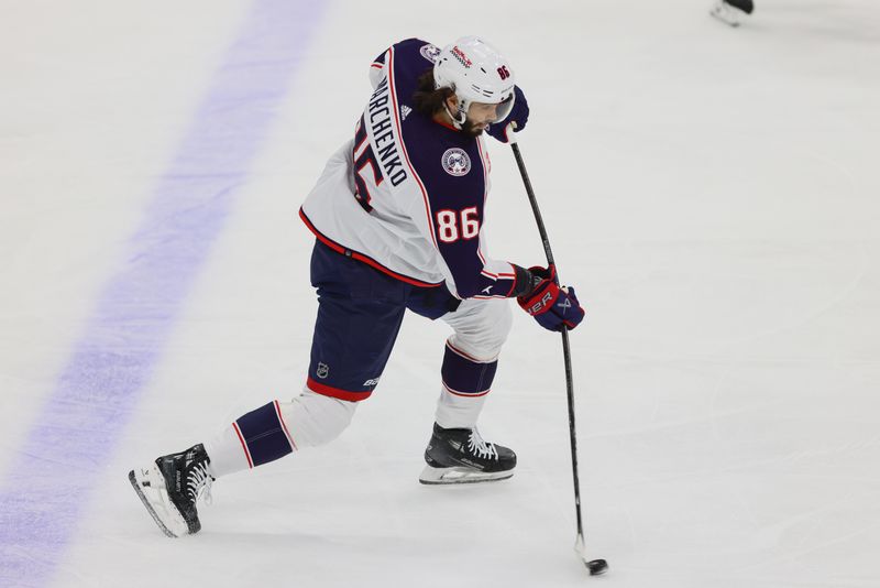 Apr 11, 2024; Sunrise, Florida, USA; Columbus Blue Jackets right wing Kirill Marchenko (86) shoots the puck against the Florida Panthers during the first period at Amerant Bank Arena. Mandatory Credit: Sam Navarro-USA TODAY Sports