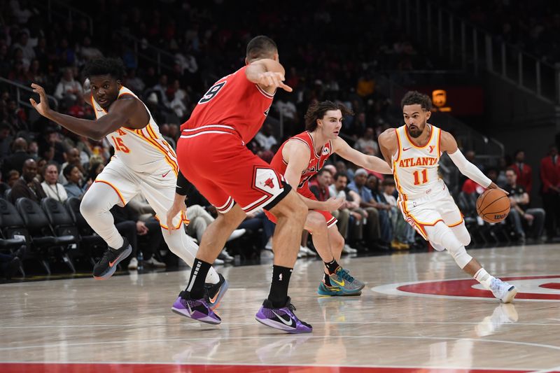 ATLANTA, GEORGIA - NOVEMBER 09:  Trae Young #11 of the Atlanta Hawks drives the ball during the game against the Chicago Bulls on November 9, 2024 at State Farm Arena in Atlanta, Georgia.    NOTE TO USER: User expressly acknowledges and agrees that, by downloading and or using this photograph, User is consenting to the terms and conditions of the Getty Images License Agreement.  (Photo by Paras Griffin/Getty Images)