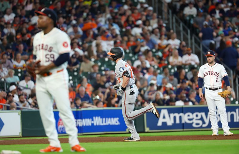 Jun 23, 2024; Houston, Texas, USA; Baltimore Orioles second baseman Jordan Westburg (11) rounds the bases after hitting a home run against Houston Astros starting pitcher Framber Valdez (59) in the sixth inning at Minute Maid Park. Mandatory Credit: Thomas Shea-USA TODAY Sports