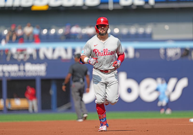 Sep 4, 2024; Toronto, Ontario, CAN; Philadelphia Phillies left fielder Kyle Schwarber (12) runs the bases after hitting home run against the Toronto Blue Jays during the first inning at Rogers Centre. Mandatory Credit: Nick Turchiaro-Imagn Images