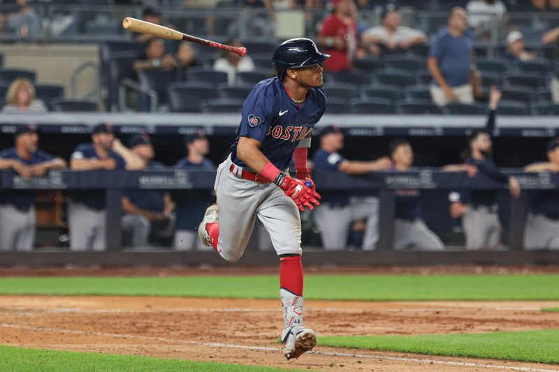 Jul 5, 2024; Bronx, New York, USA; Boston Red Sox center fielder Ceddanne Rafaela (43) hits a two run home run during the tenth inning against the New York Yankees at Yankee Stadium. Mandatory Credit: Vincent Carchietta-USA TODAY Sports