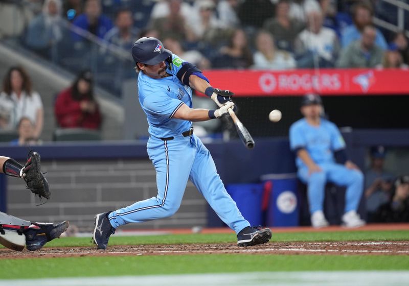 May 11, 2024; Toronto, Ontario, CAN; Toronto Blue Jays left fielder Davis Schneider (36) hits a single against the Minnesota Twins during the sixth inning at Rogers Centre. Mandatory Credit: Nick Turchiaro-USA TODAY Sports