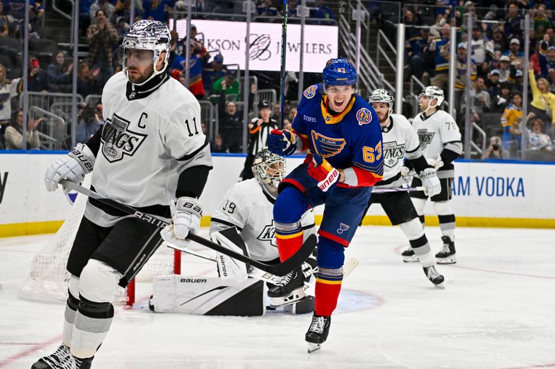 Mar 13, 2024; St. Louis, Missouri, USA;  St. Louis Blues left wing Jake Neighbours (63) reacts after scoring against Los Angeles Kings goaltender Cam Talbot (39) during the second period at Enterprise Center. Mandatory Credit: Jeff Curry-USA TODAY Sports