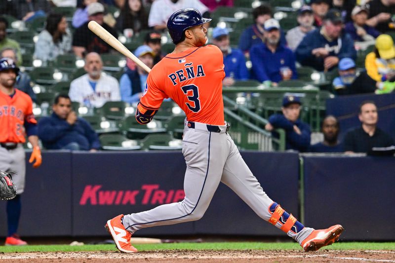 May 7, 2025; Milwaukee, Wisconsin, USA; Houston Astros shortstop Jeremy Pena (3) hits a 3-run home run in the sixth inning against the Milwaukee Brewers at American Family Field. Mandatory Credit: Benny Sieu-Imagn Images