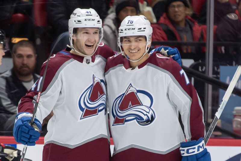 Jan 16, 2024; Ottawa, Ontario, CAN; Colorado Avalanche right wing Jason Polin (41) celebrates with defenseman Sam Malinski (70) his goal scored in the second period against the Ottawa Senators at the Canadian Tire Centre. Mandatory Credit: Marc DesRosiers-USA TODAY Sports