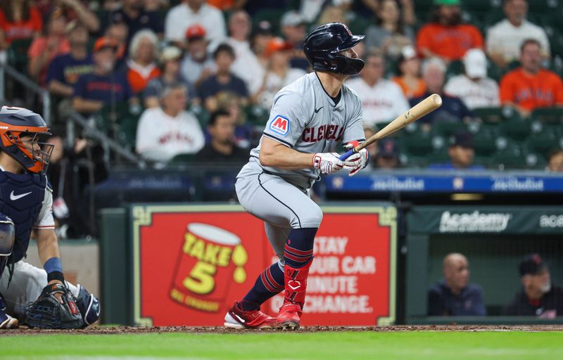 May 2, 2024; Houston, Texas, USA; Cleveland Guardians right fielder Will Brennan (17) hits a single during the second inning against the Houston Astros at Minute Maid Park. Mandatory Credit: Troy Taormina-USA TODAY Sports