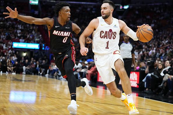 MIAMI, FLORIDA - DECEMBER 08: Max Strus #1 of the Cleveland Cavaliers dribbles the ball past Josh Richardson #0 of the Miami Heat during the second quarter at Kaseya Center on December 08, 2023 in Miami, Florida. NOTE TO USER: User expressly acknowledges and agrees that, by downloading and or using this photograph, User is consenting to the terms and condtions of the Getty Images License Agreement.  (Photo by Rich Storry/Getty Images)