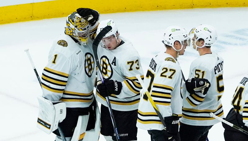 Oct 24, 2023; Chicago, Illinois, USA; The Boston Bruins celebrate their win against the Chicago Blackhawks at United Center. Mandatory Credit: David Banks-USA TODAY Sports