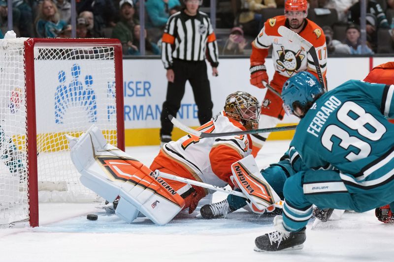 Oct 11, 2025; San Jose, California, USA; A shot by San Jose Sharks defenseman Mario Ferraro (38) gets past Anaheim Ducks goaltender Petr Mrazek (center) for a goal during the second period at SAP Center at San Jose. Mandatory Credit: Darren Yamashita-Imagn Images