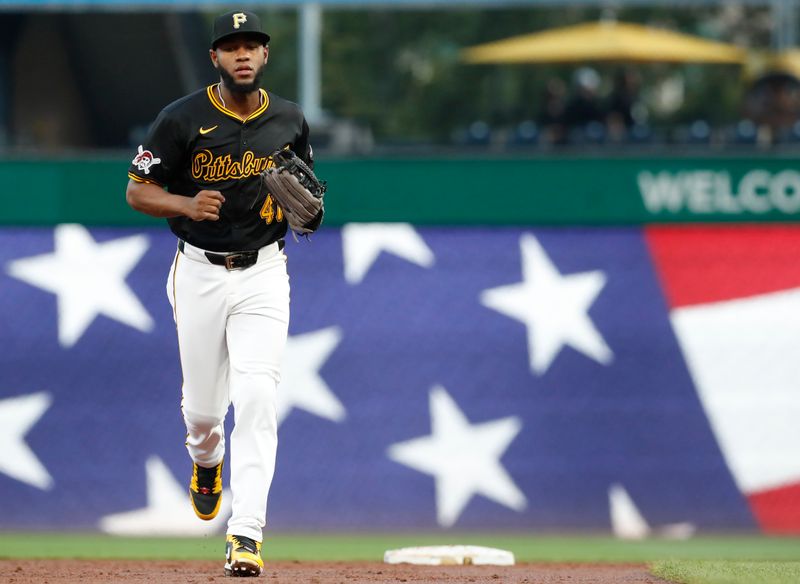 Aug 27, 2024; Pittsburgh, Pennsylvania, USA;  Pittsburgh Pirates right fielder Bryan De La Cruz (41) returns to the dugout against the Chicago Cubs after the third inning at PNC Park. Mandatory Credit: Charles LeClaire-USA TODAY Sports