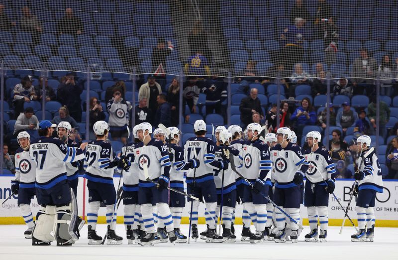 Mar 3, 2024; Buffalo, New York, USA;  The Winnipeg Jets celebrate a win over the Buffalo Sabres at KeyBank Center. Mandatory Credit: Timothy T. Ludwig-USA TODAY Sports