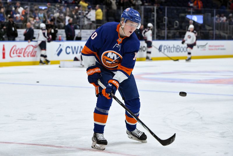 Dec 7, 2023; Elmont, New York, USA; New York Islanders right wing Simon Holmstrom (10) warms up prior to a game against the Columbus Blue Jackets at UBS Arena. Mandatory Credit: John Jones-USA TODAY Sports