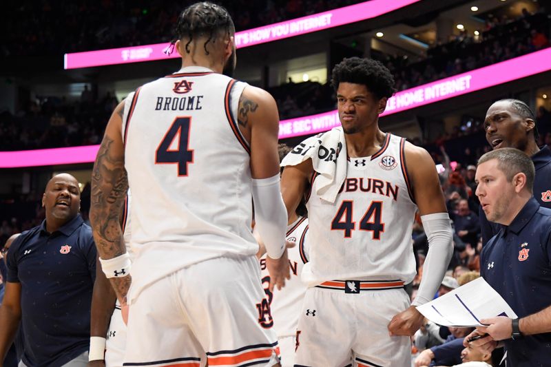 Mar 17, 2024; Nashville, TN, USA;  Auburn Tigers center Dylan Cardwell (44) and forward Johni Broome (4) react after a play in the first half against the Florida Gators in the SEC Tournament championship game at Bridgestone Arena. Mandatory Credit: Steve Roberts-USA TODAY Sports