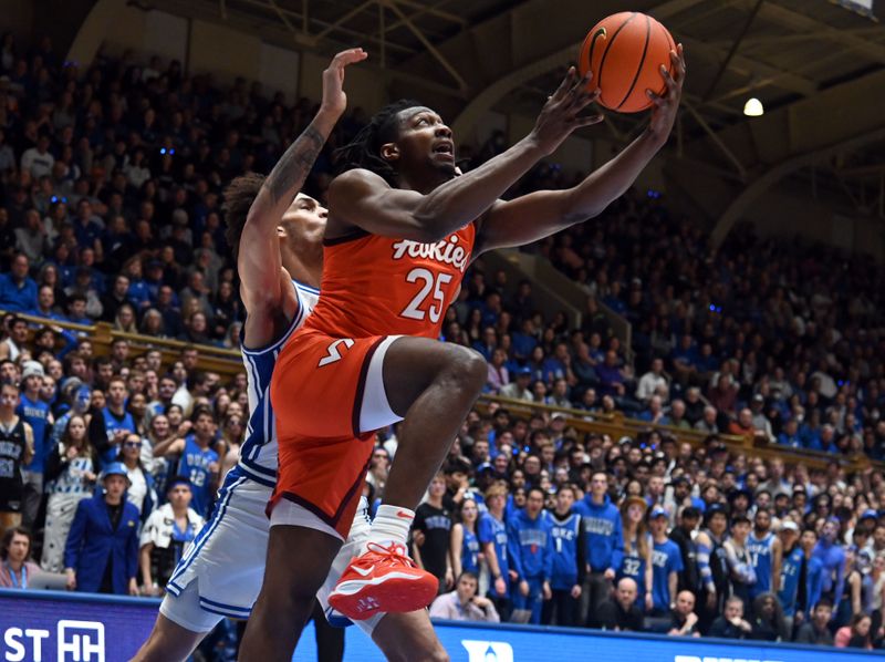 Feb 25, 2023; Durham, North Carolina, USA;  Virginia Tech Hokies forward Justyn Mutts (25) lays the ball up in front of Duke Blue Devils center Dereck Lively (1) during the first half at Cameron Indoor Stadium. Mandatory Credit: Rob Kinnan-USA TODAY Sports