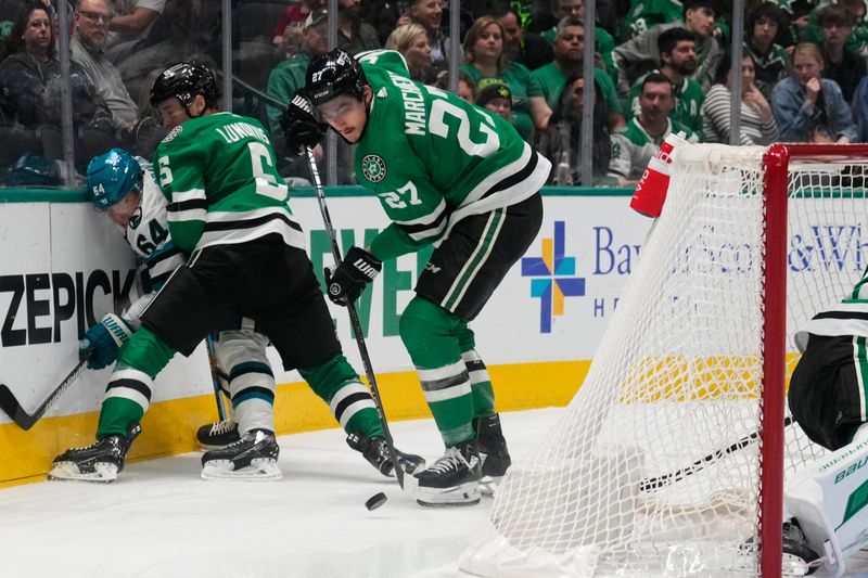 Mar 2, 2024; Dallas, Texas, USA;  Dallas Stars left wing Mason Marchment (27) controls the puck against the San Jose Sharks during the first period at American Airlines Center. Mandatory Credit: Chris Jones-USA TODAY Sports